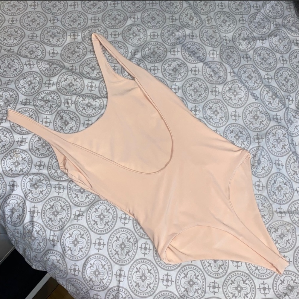 Brand new peach bodysuit